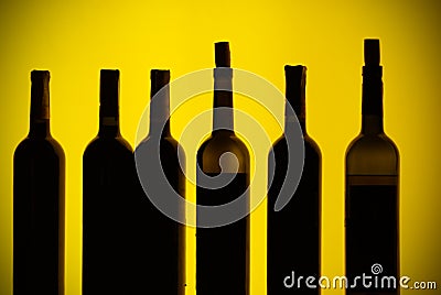 Backlit bottles behind a bar Stock Photo