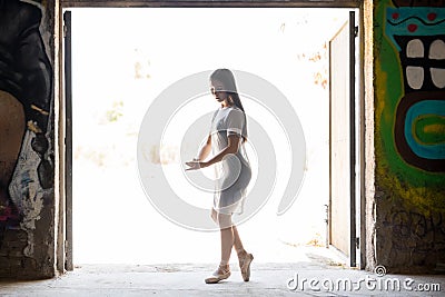 Backlit female dancer performing Stock Photo