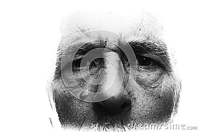 Backlit image with blown out edges showing close up of man`s face, highly detailed with shallow depth of field Stock Photo