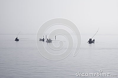 Traditional fishing boats during toil Stock Photo