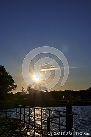 Backlit shot of a sunset at the coast of the Baltic Sea in Germany Stock Photo