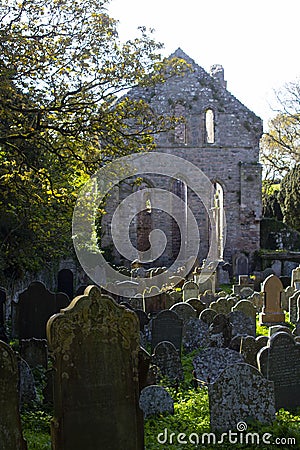 A backlit view of the ruins of the historic Greyabbey Monastery Editorial Stock Photo