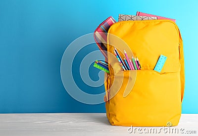 Backpack with different colorful stationery Stock Photo