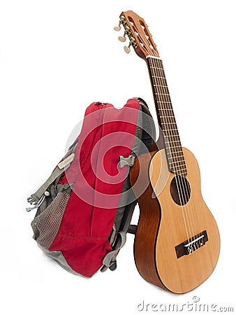 Backpack and guitar. Stock Photo