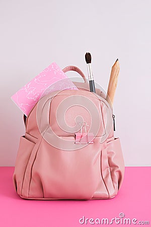 Backpack with school supplies. Back to school concept. Stock Photo
