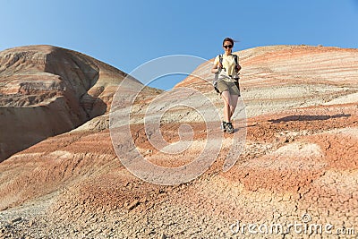 Backpacker girl exploring the mountains. Backpacker girl tourist exploring the Xizi mountains , Azerbaijan. Stock Photo