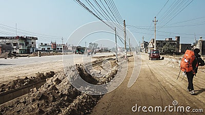 A backpacker just entering Belahiya, one of the western entry point to Nepal. Stock Photo