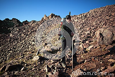 Backpacker in morning mountains Stock Photo