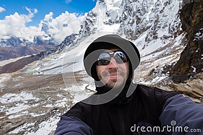 Backpacker mountaineer selfie. Stock Photo