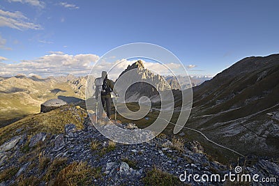 Backpacker observes the Alps Stock Photo