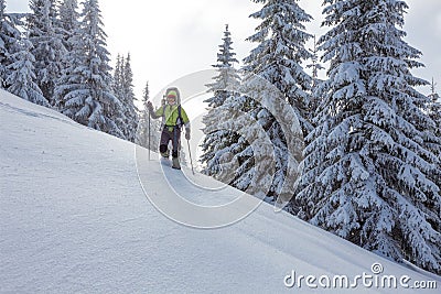 Backpacker posing in winter mountains Stock Photo