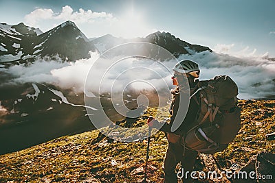 Backpacker woman enjoying mountains clouds Stock Photo