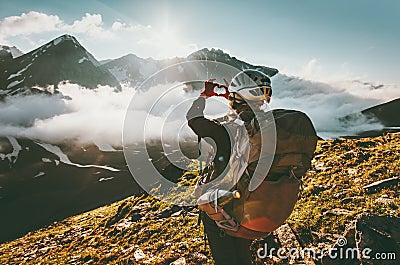 Backpacker woman hands showing heart shape enjoying mountains Stock Photo