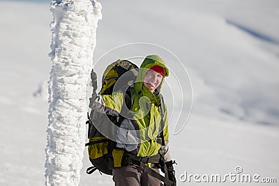 Backpacker woman posing in mountains Stock Photo