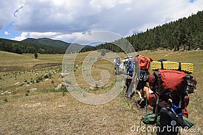 Backpacking across a Meadow in New Mexico Stock Photo