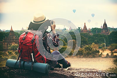 Backpacking woman traveller and photographing in Bagan Mandalay Stock Photo