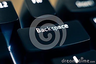 Backspace Key Close-up on Backlit Keyboard. Stock Photo