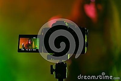 Backstage operator working professional camera. Videographer shoots music clip Stock Photo