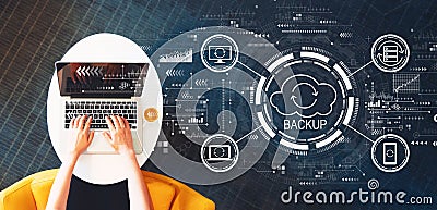 Backup concept with person using a laptop Stock Photo