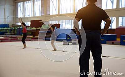 Backyard of coach in gymnastic kid practice in gym Stock Photo