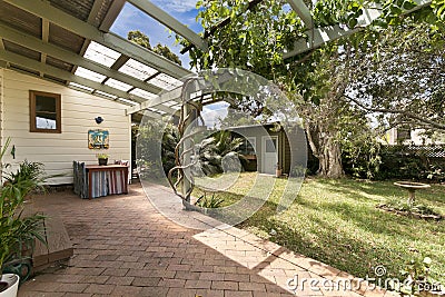 Backyard cozy patio area with wicker furniture set Stock Photo