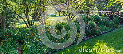 Backyard flower garden by a playground Stock Photo