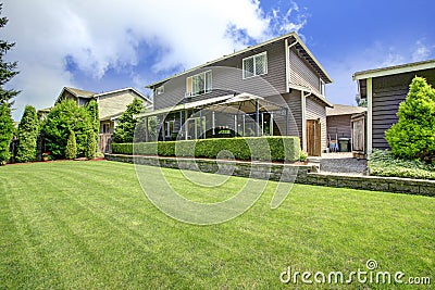 Backyard landscape with trimmed hedges Stock Photo