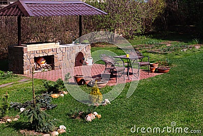 Barbecue Patio Area in Backyard.Gren Grass, Red Brick. Stock Photo