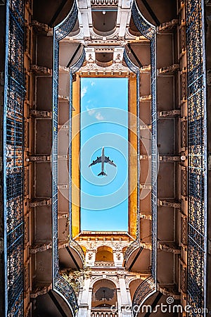 Typical courtyard or backyard of a Budapest apartment building, Historical residential buildings with airplane in the sky Stock Photo