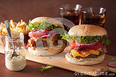 Bacon cheese burger with beef patty tomato onion Stock Photo