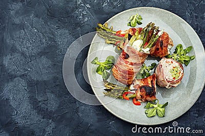 Bacon meat roll stuffed with asparagus Stock Photo