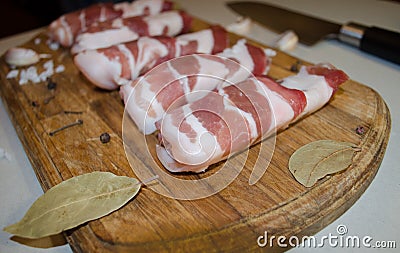 Bacon meat rolls on a wooden board Stock Photo