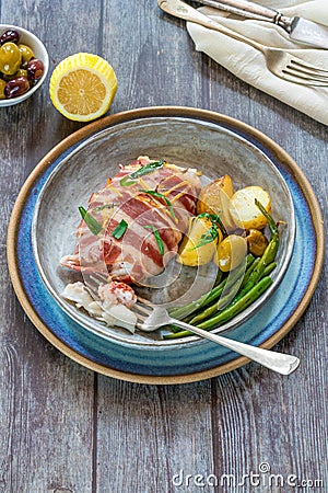 Bacon-wrapped haddock stuffed with crayfish tails Stock Photo