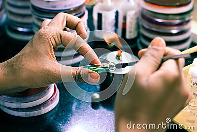 Bacterial Inoculation on a test tube agar culture media using inoculation loop by scientist lab technician in a microbiology labor Stock Photo