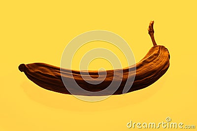 Bad banana on yellow Stock Photo