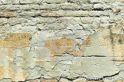 Bad foundation base on old house or building cracked plaster facade wall with brick background Stock Photo