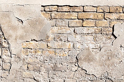 Bad foundation base on old house or building cracked plaster facade wall with brick background Stock Photo