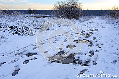 Bad muddy winter road. Beautiful winter landscape. Stock Photo