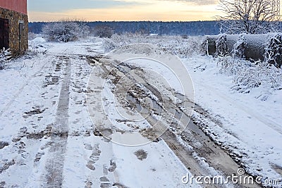 Bad muddy winter road. Beautiful winter landscape. Bad rural winter road Stock Photo