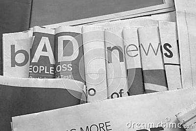 Bad news on newspapers black and white background Stock Photo