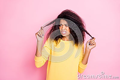 Bad quality shampoo. I dont like it. Portrait of frustrated black girl look her hair dislike new anti dander dandruff Stock Photo