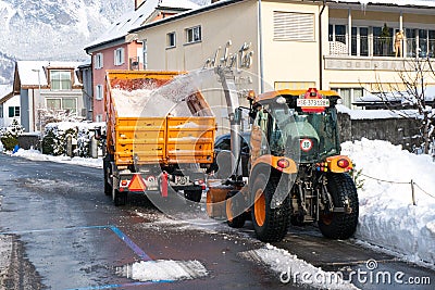 Bad Ragaz, SG / Switzerland - January 11, 2019: city workers clearing snow from the roads in Bad Ragaz after heavy winter Editorial Stock Photo