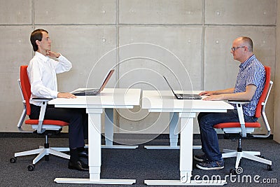 Bad sitting position at workstation correction Stock Photo