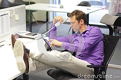 Bad sitting posture - man in office Stock Photo