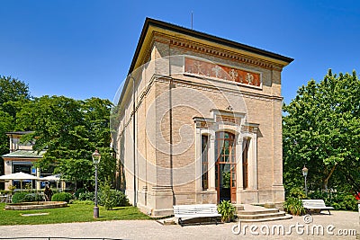 Baden-Baden, Germany - Side view of historic pump house called Trinkhalle next to cafe Editorial Stock Photo