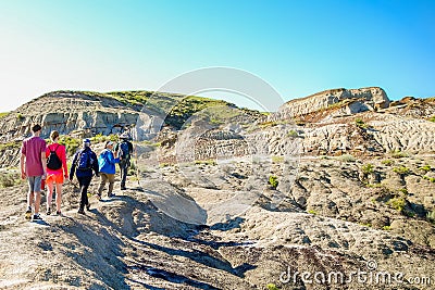 People hiking amidst the landscapes in Alberta`s Dinosaur Provincial Park Editorial Stock Photo