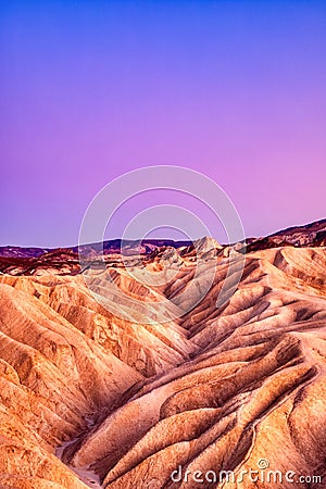 Badlands view from Zabriskie Point in Death Valley National Park at Dusk Stock Photo