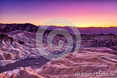 Badlands view from Zabriskie Point in Death Valley National Park at Dusk Stock Photo