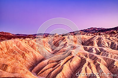 Badlands view from Zabriskie Point in Death Valley National Park at Dusk Stock Photo