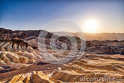 Badlands view from Zabriskie Point in Death Valley National Park at Sunset Stock Photo